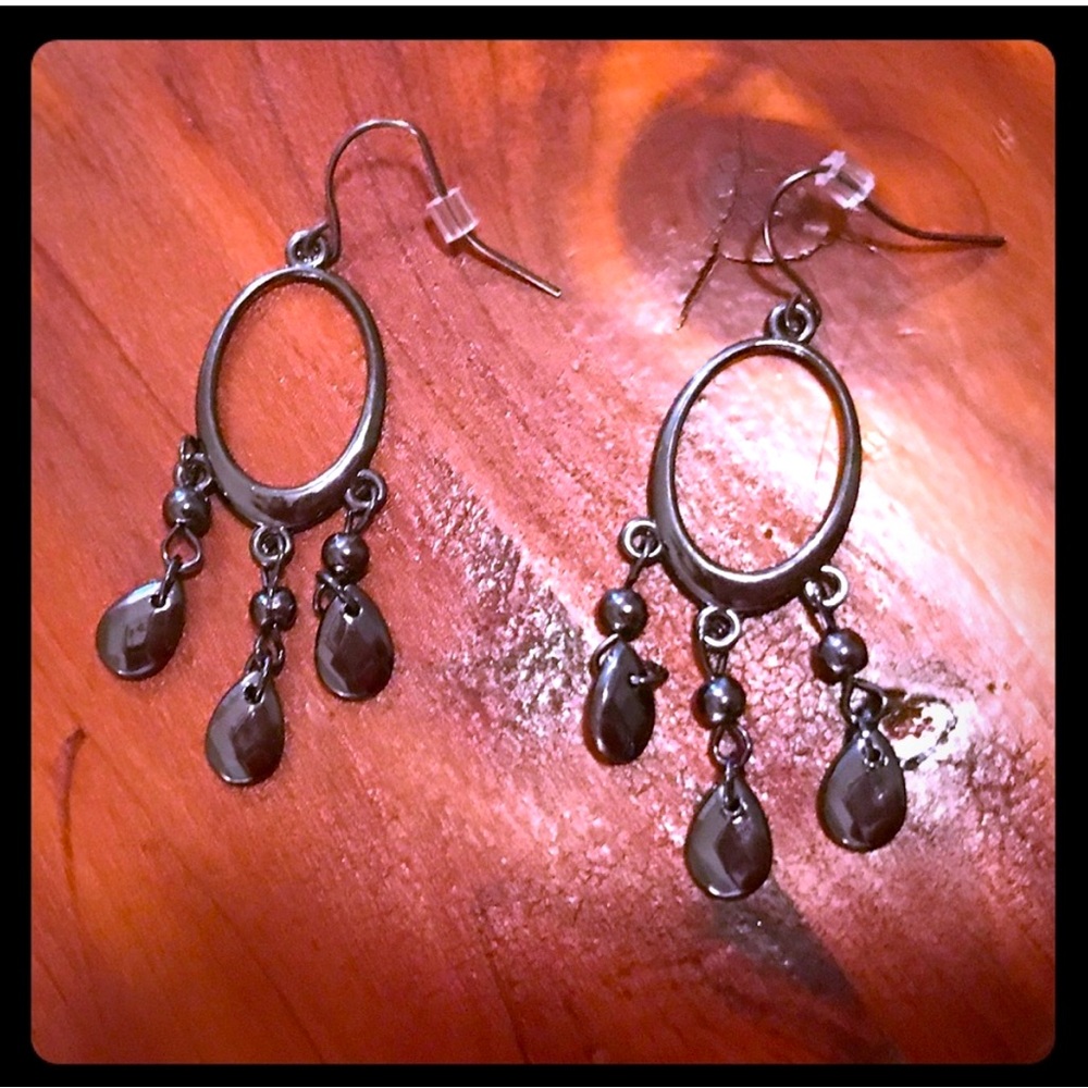 Gunmetal dangle earrings.
.